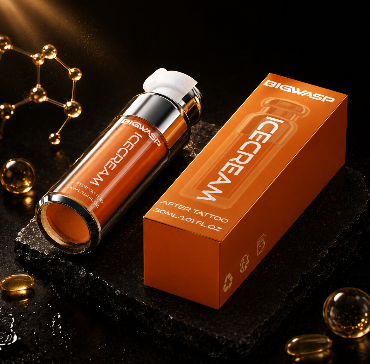 BIGWASP Icecream After Tattoo serum bottle and its orange packaging box, styled on a dark textured stone slab with gold decorative elements.